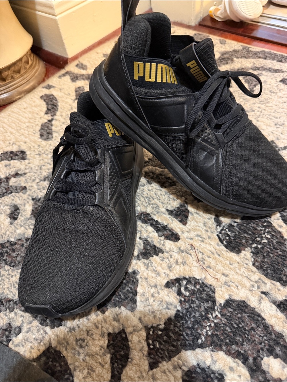 Puma Men’s Black Athletic Sneakers with Gold Logo Accent